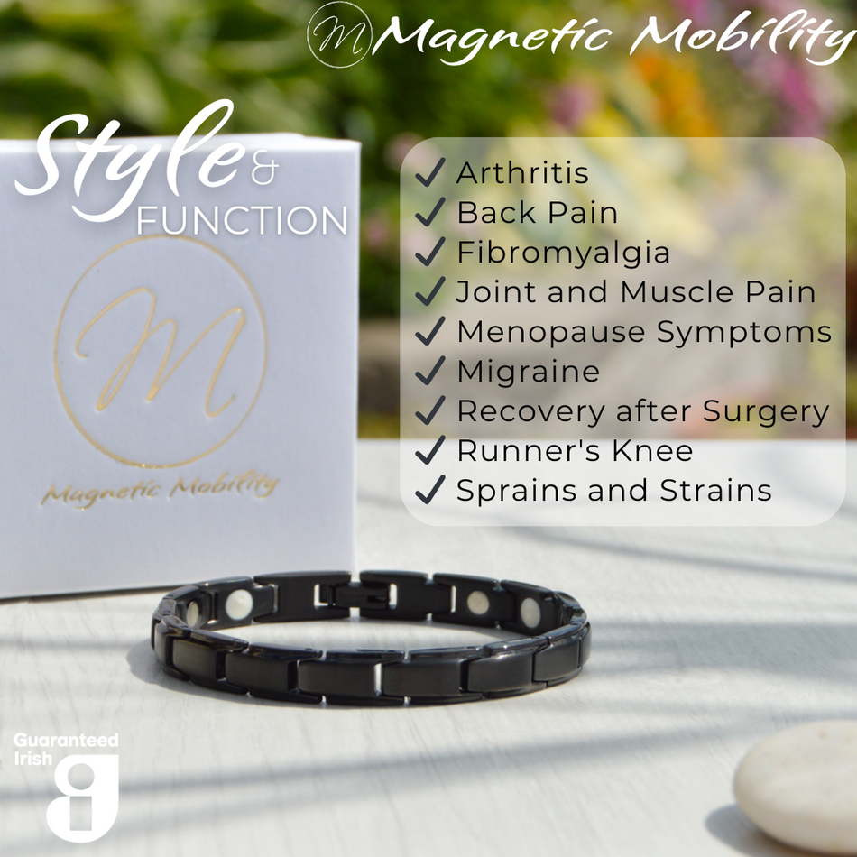 Close-up of Apia Night 4in1 Magnetic Bracelet from Magnetic Mobility, emphasizing simple black links. Text on image: 'Designed for people with Arthritis, Back Pain, Fibromyalgia, Joint and Muscle Pain, Menopause Symptoms, Migraine, Recovery after Surgery, Runner's Knee, Sprains and Strains.' Promotes style and function with Guaranteed Irish quality.