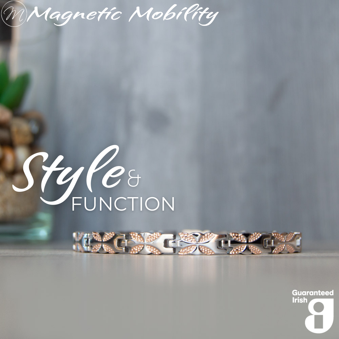 Front view of the Meadowsweet Dusk 4in1 magnetic bracelet by Magnetic Mobility, promoting arthritis, back pain, fibromyalgia relief with a stylish silver and rose gold butterfly design