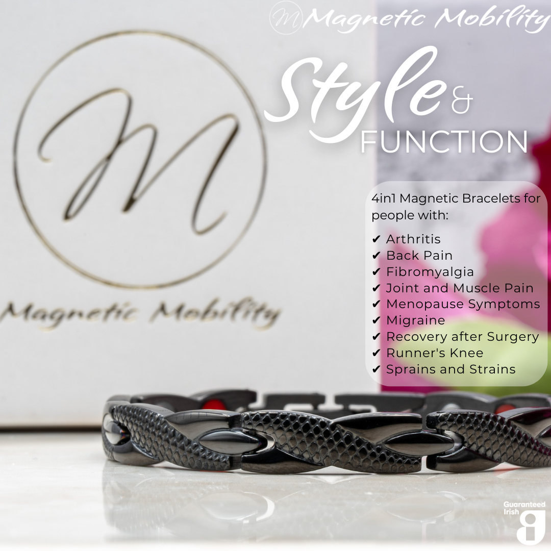 Close up view of the Snapdragon Night 4in1 magnetic bracelet by Magnetic Mobility. Shown on a reflective surface with pink flowers in the background. The text says "Style and Function"