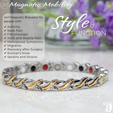 45 degree view of the Virginia moon 4in1 Magnetic Bracelet from Magnetic Mobility. Features and intricate Silver and Gold twist with the 4in1 elements hidden in the back. Perfect for people with arthritis, back pain, fibromyalgia, joint and muscle pain, menopause symptoms, migraine and more. The bracelet is shown on a reflective surface with purple flowers behind it and a white gift box. Features the Guaranteed Irish logo. 