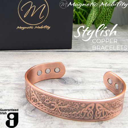 45 degree view of the Buckthorn Copper Bracelet from Magentic Mobility. A celtic tree of life design features on the front of this copper bracelet and the strong neodynimum magnetis can be seen in the back of the open bangle. 