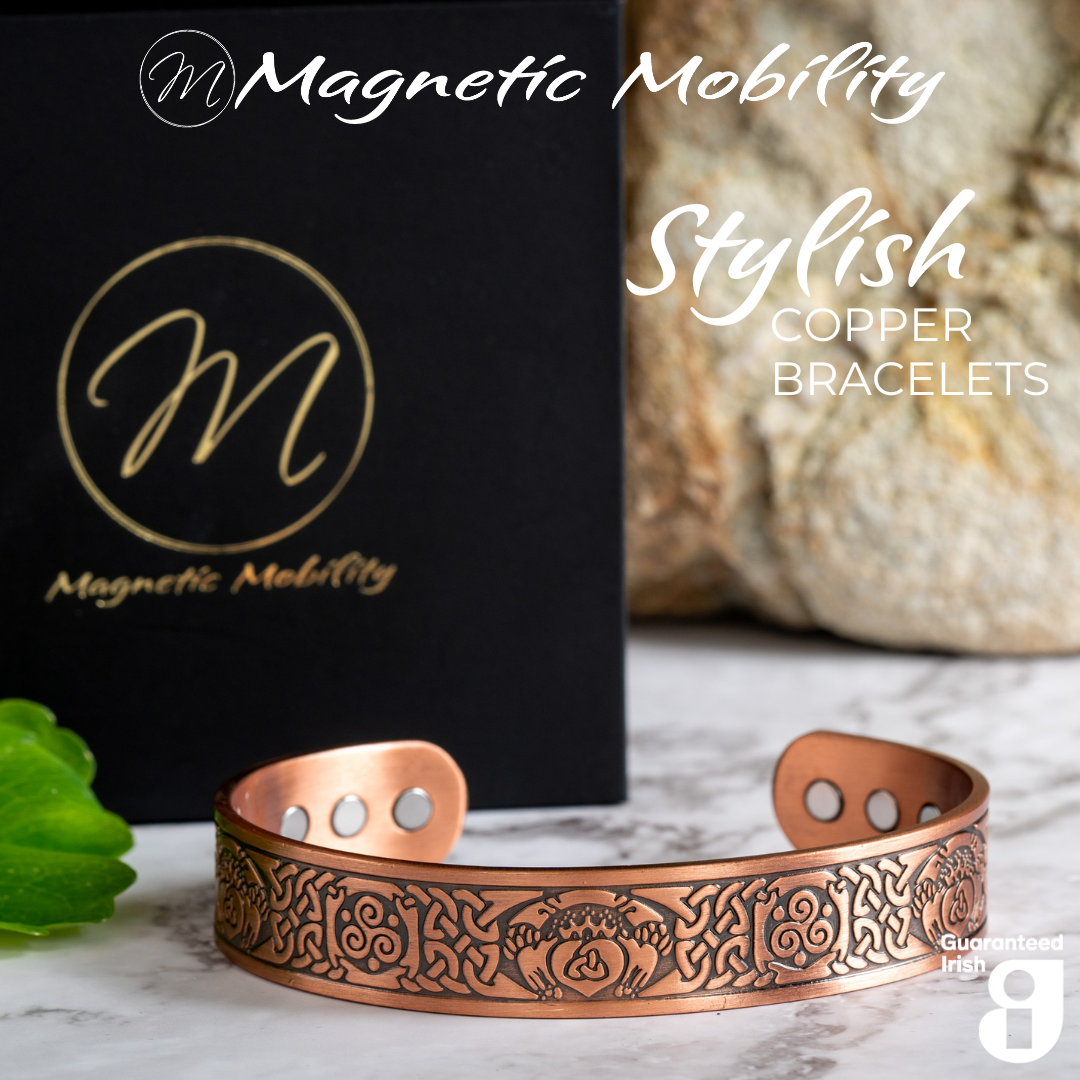 Front view of the Claddagh Copper bracelet from Magnetic Mobility. The bracelet features a Claddagh design of 2 hands holding a heart with a Triquetra sign in the middle. A classic Irish design with intricate Irish knots on the sides of this copper bracelet. 