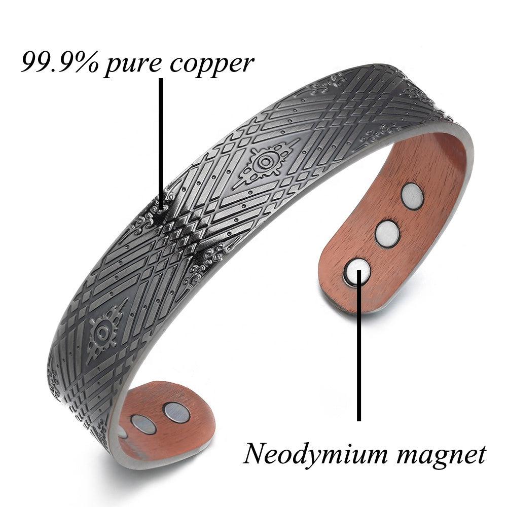 Stylish copper magnetic bracelet from Magnetic Mobility, featuring intricate geometric design and guaranteed Irish quality. The copper bracelet is presented on a reflective surface with the words "Style and Function".