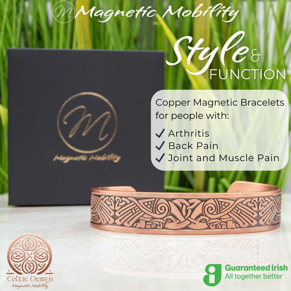 Front view of the Kells Copper bracelet from Magnetic Mobility. A copper bracelet with a Irish design inspired by the Book of Kell's. Featuring 6 strong neodymium magnets. Perfect for people with arthritis and back pain. 99% pure copper. the image shows the bracelet in front of a black gift box and green grass. Part of the Celtic Collection from Magnetic Mobility.