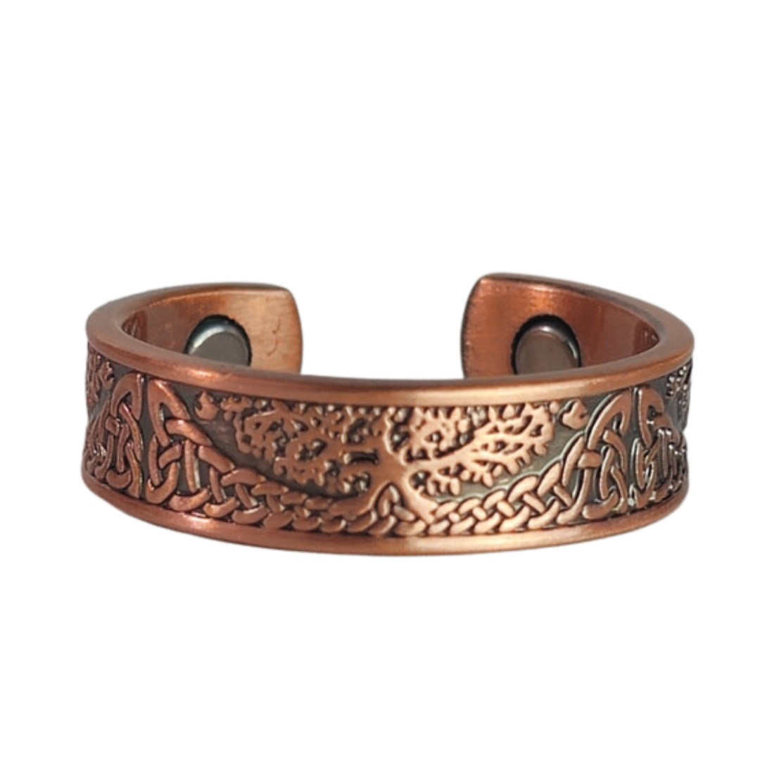 Buckthorn copper ring by Magnetic Mobility featuring an intricate Tree of Life design. This adjustable ring is designed to be easily worn on arthritic fingers, providing both style and functionality.