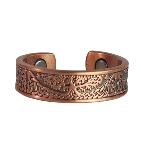 Buckthorn copper ring by Magnetic Mobility featuring an intricate Tree of Life design. This adjustable ring is designed to be easily worn on arthritic fingers, providing both style and functionality.