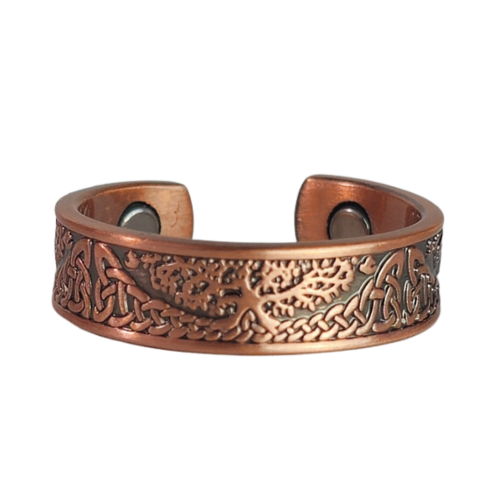 Buckthorn copper ring by Magnetic Mobility featuring an intricate Tree of Life design. This adjustable ring is designed to be easily worn on arthritic fingers, providing both style and functionality.