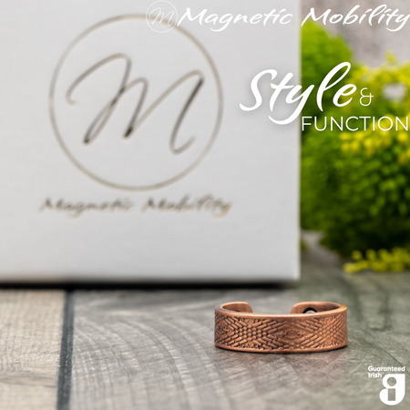 Hawthorn copper ring by Magnetic Mobility featuring an intricate geometric design. Ring is shown in front of a white branded gift box. This adjustable ring is designed to be easily worn on arthritic fingers, providing both style and functionality.