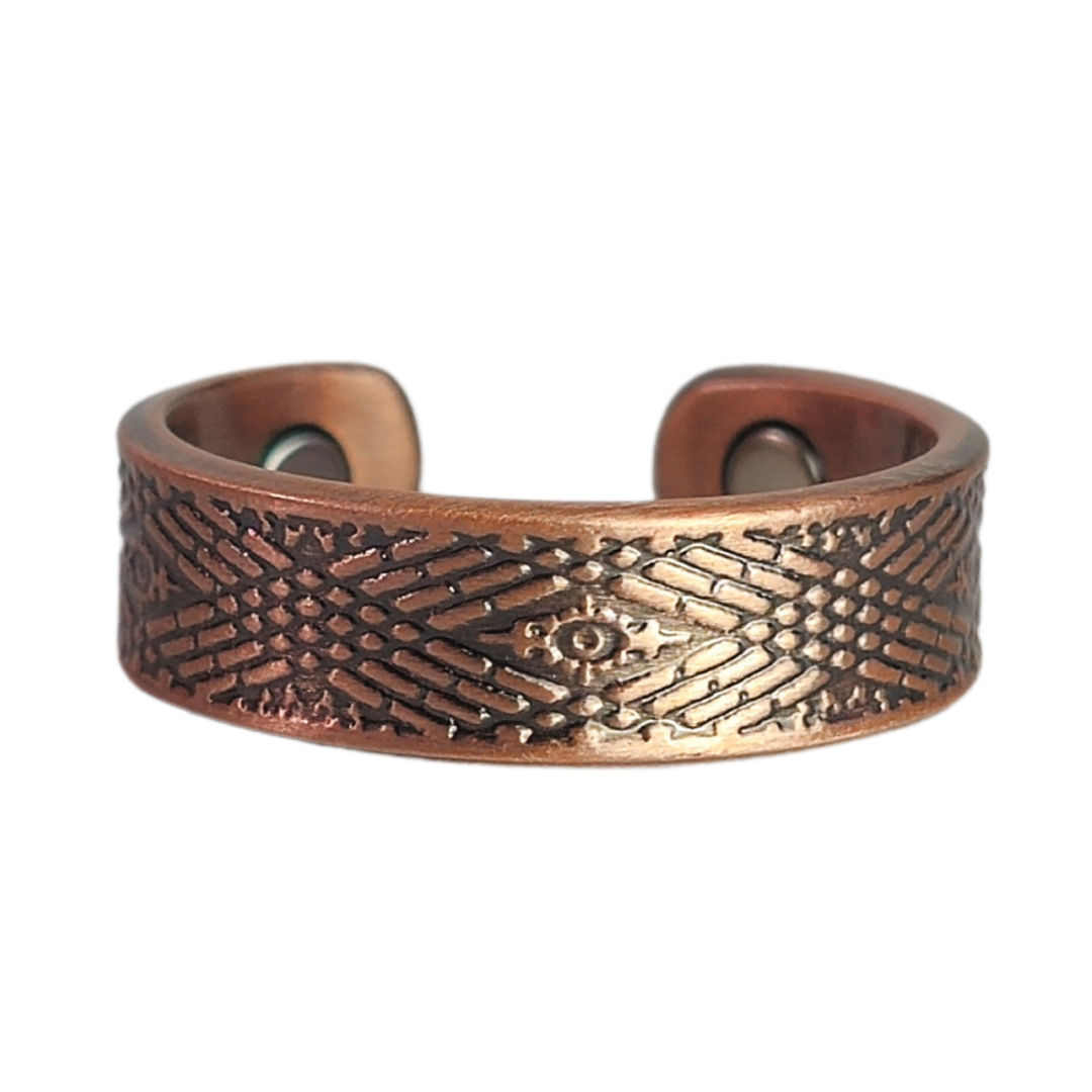 Hawthorn copper ring by Magnetic Mobility featuring an intricate geometirc design. This adjustable ring is designed to be easily worn on arthritic fingers, providing both style and functionality.