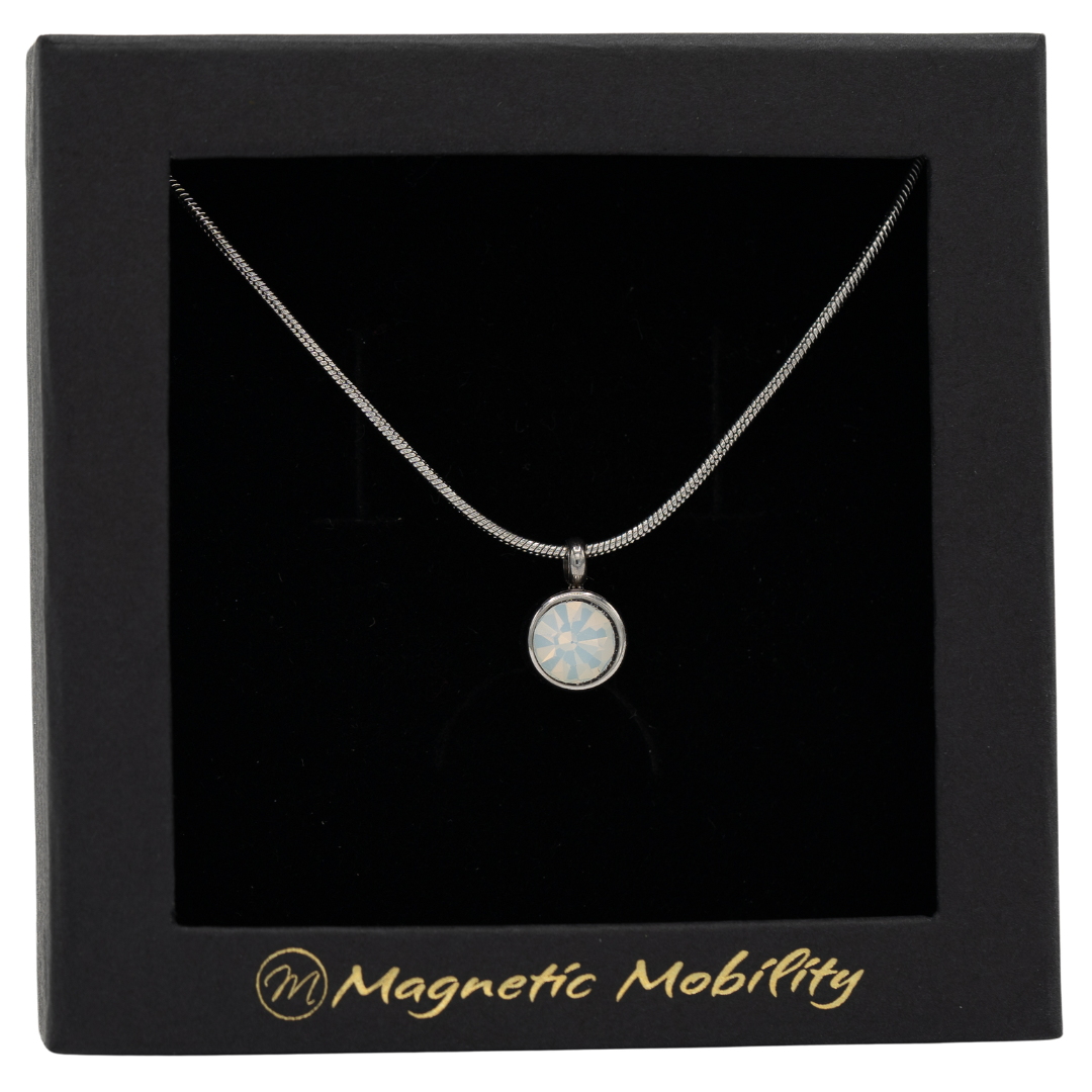 June Birthstone Necklace from Magnetic Mobility featuring an opal Swarovski crystal pendant with a magnet. Ideal for neck pain relief, displayed in a stylish black box.